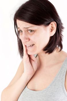 young woman with tooth ache making massage to avoid pain