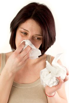 sneezing woman holding tissues, allergy or cold flu concept