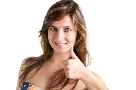 Attractive young woman giving the thumbs-up, isolated on a white background