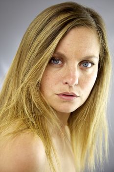 Portrait of beautiful woman without makeup and messy hair