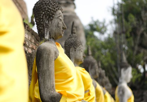 Ancient Buddha statues at Wat Yai Chai Mongkol in Ayutthaya, Thailand 