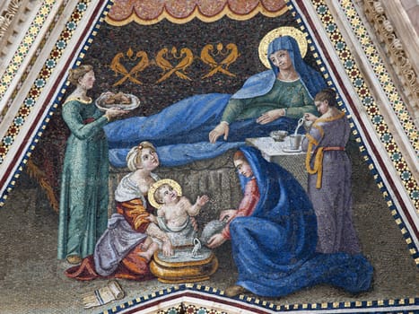 Orvieto - Duomo Facade.Nativity of the Virgin. Mosaic of the right portal of the cathedral