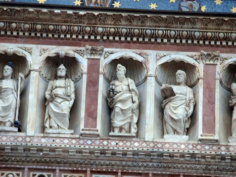 Detail of the facade of Orvieto Cathedral. (1290 - 1600 a. c.) Richly decorated with lots of stone mosaics