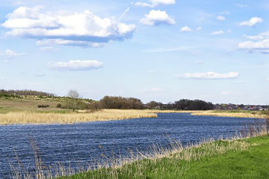 Spring landscape with the river in the hills