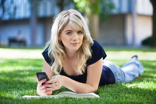 Portrait of a cute girl using cell phone