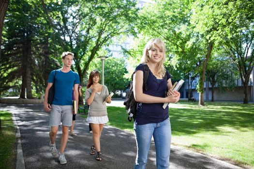 Group of students on their way to class walking through campus
