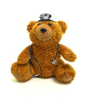 Toy bear with stethoscope and headlamp