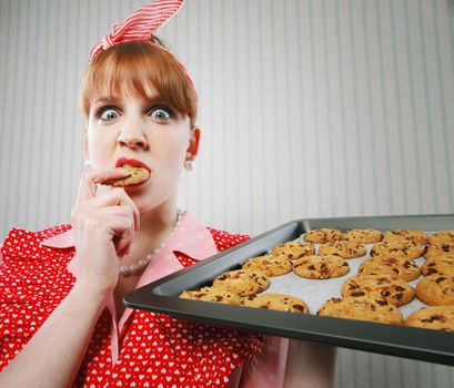 Retro housewife sneaking cookies
