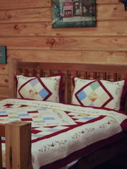 Bedroom in a Log Cabin house