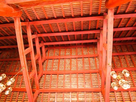 Wooden roof structure with main beam and joist in Buddhist vihara in Pai, Mae hong son, Thailand