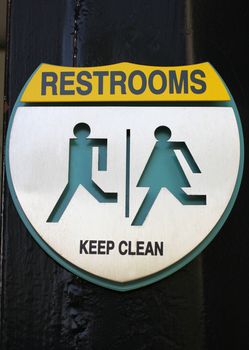 Sign of public restroom silver metallic plate
