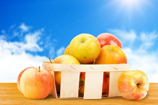 Fresh and colorful apples in basket, selective focus