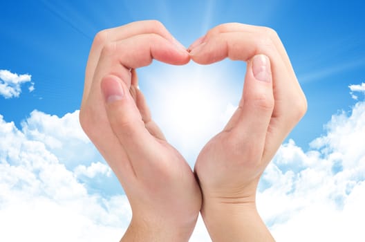 Two hands form a heart shape with their fingers