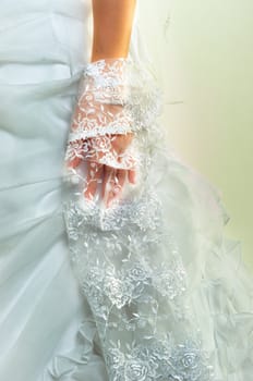 Woans hand in wedding dress