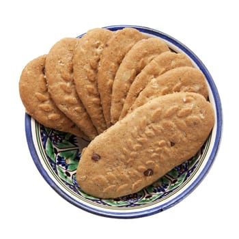 Cereal cookies in a bowl isolated over white