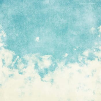 Sky, fog, and clouds on a textured, vintage paper background with grunge stains