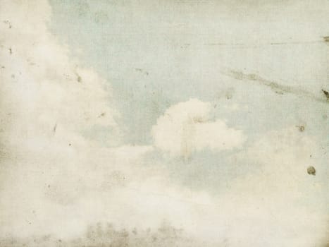 Fog and clouds on a vintage, textured paper background with a color gradient.