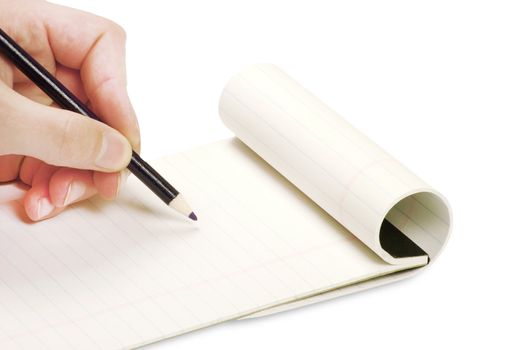 Pencil in hand writing on the notebook