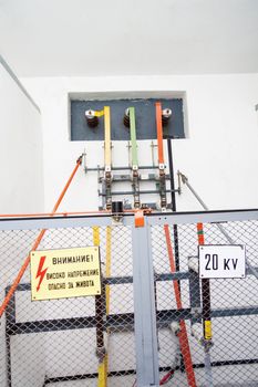 High voltage equipement with a fence and warning signs