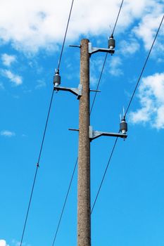 Concrete electricity post on blue sky background