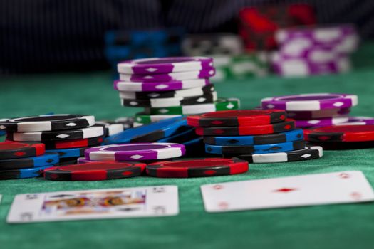 Poker chips and cards in a Texas hold 'em game.