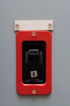 Industrial circuit breaker with a warning sign