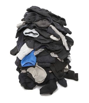 Heap of unsorted socks isolated over white