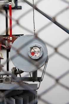 Gauge of a high voltage transformator shot trough the safety fence