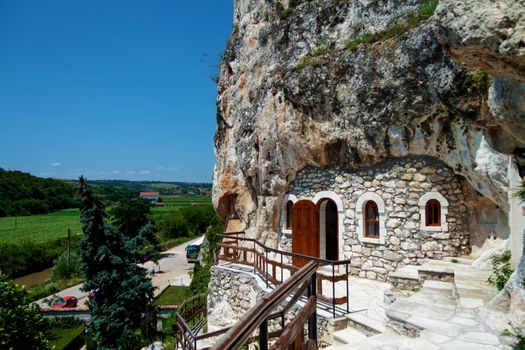 Orthodox monastery excavated in the rocks view from above