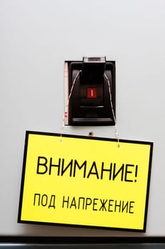 Industrial circuit breaker with a warning sign