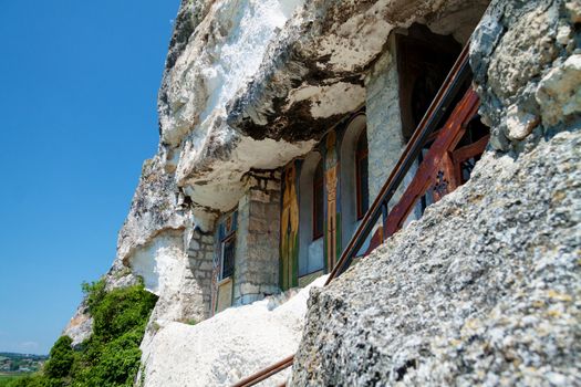 Orthodox monastery excavated in the rocks view from below