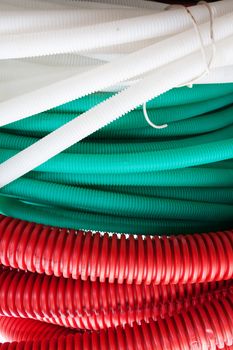White, green and red cable hoses