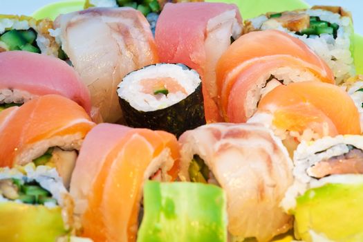 Close up of colorful sushi with raw fish, horizontal