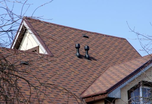 Brown roof on a background of the sky