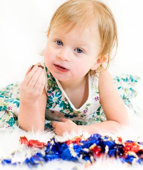 beautiful girl in a dress eats candy close - up