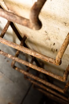 Rusty ladder leading into hole