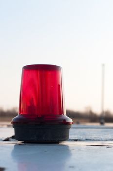 A red siren on a top of a car