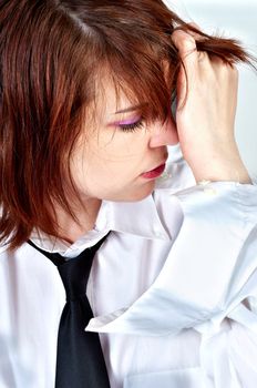 young business woman holding her head