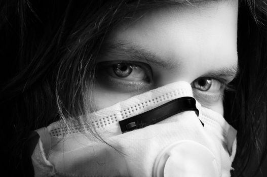 girl wearing protective mask in black and white