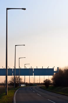 Old road with copyspace sign