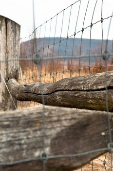 barbed wire on wooden fence