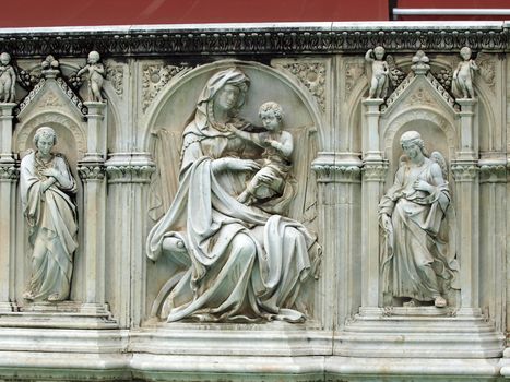 Madonna and Child with two angels. Panel of the Fonte Gaia (Fountain of Joy), Piazza del Campo, Siena.