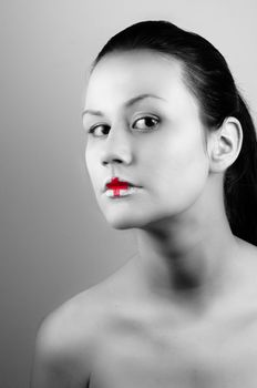 Black and white ohoto of a girl with medical lipstick