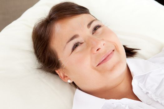 Acupuncture patient smiling and looking up