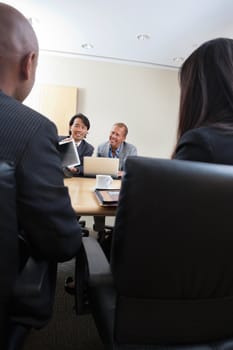 Smiling professionals in a business meeting