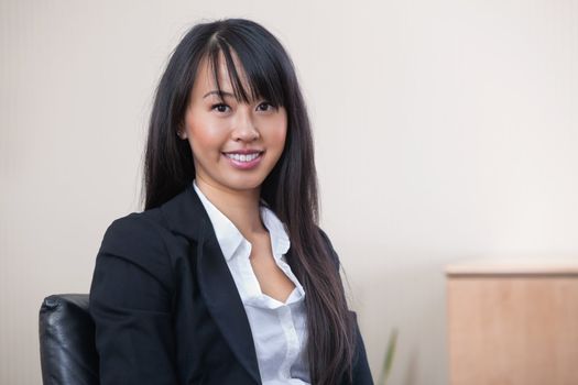 Portrait of a cheerful young businesswoman smiling