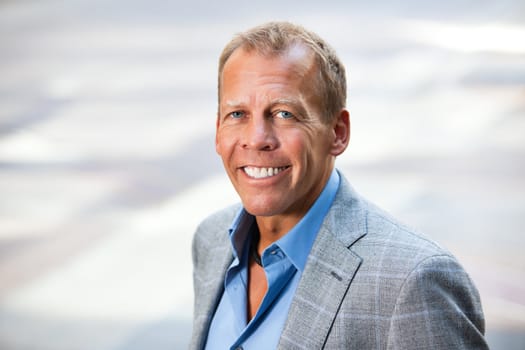 Portrait of cheerful businessman outdoors