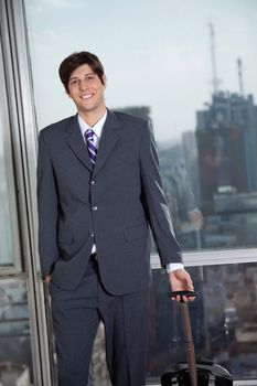 Portrait of handsome businessman going for a business trip