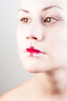 Conceptual makeup on a young girl with white skin