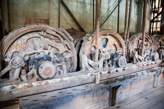 Four large engines in an abandoned gold dredge